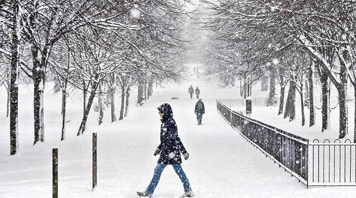 Sporting events and travel grind to a halt as cold snap grips UK